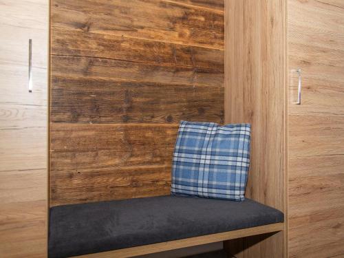 a bench with a pillow sitting on top of a wall at Gasthof Appartements Gamskar in Bad Gastein