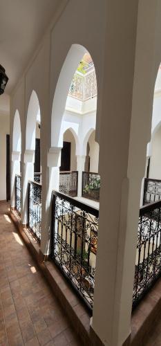 a building with arches and a balcony at Dar Salam Palm - Guest Choice Award 2024 in Marrakech