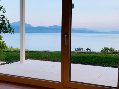 a door leading to a view of the water at #Lavaux in Lutry