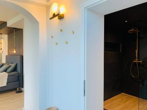 a bathroom with a glass door leading to a shower at #Lavaux in Lutry