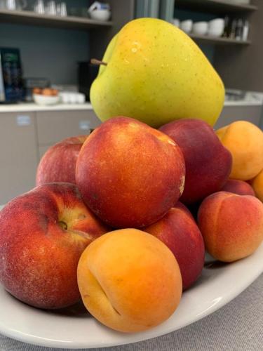 a pile of apples and pears on a plate at Casale al Foino in Induno Olona