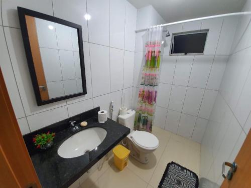 Ванная комната в Apartamento aconchegante em Luis Correia