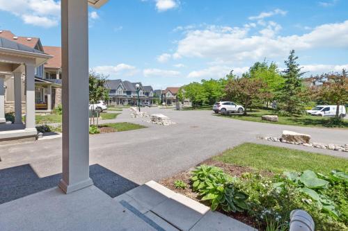a street in a residential neighborhood with cars parked at Modern home with a pool sauna pooltable & mountain view in Collingwood