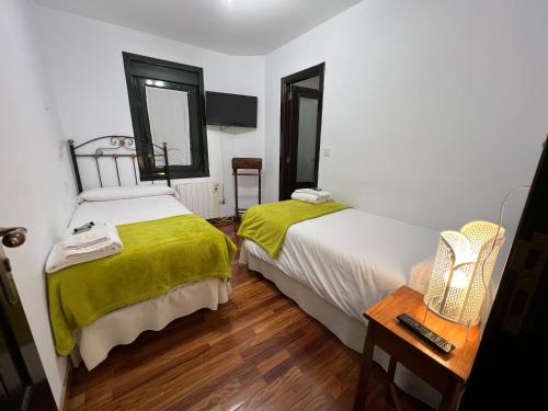 Postel nebo postele na pokoji v ubytování Hotel Rústico Finisterrae