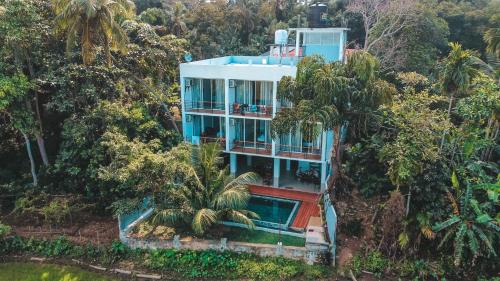 an aerial view of a house in the forest at Green Edge Villa in Hikkaduwa
