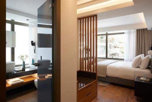 Teight Hotelにあるベッド