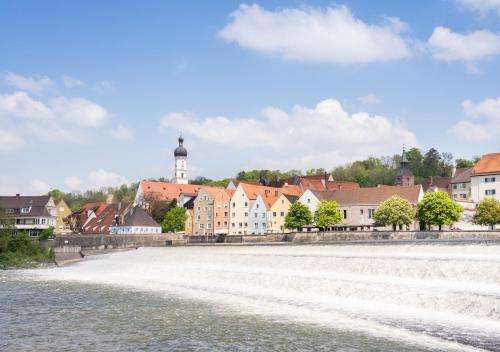 a view of a town from the river at Arthotel ANA Goggl in Landsberg am Lech