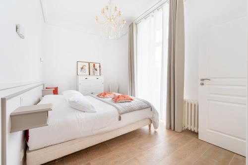 Säng eller sängar i ett rum på Domaine Les Jardins dArsene