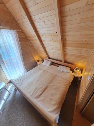 Giường trong phòng chung tại Planinska brvnara
