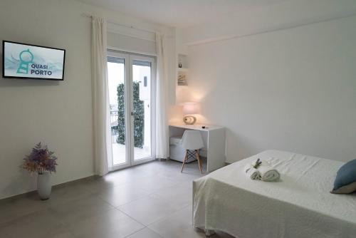 Ein Bett oder Betten in einem Zimmer der Unterkunft Quasi in Porto