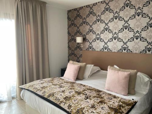 Ένα ή περισσότερα κρεβάτια σε δωμάτιο στο Hotel & Restaurant Les Bergeries d'Alata