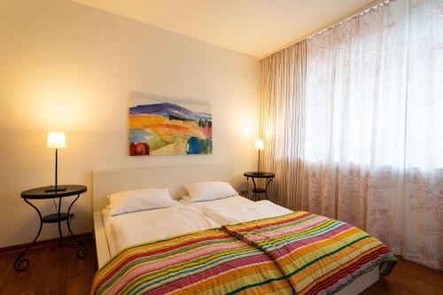 a bedroom with a bed and a painting on the wall at Ferienhof Homann Sauerland in Brilon