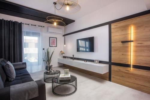 a living room with a couch and a sink at Rhodes Diamond luxury flat in the heart of town in Rhodes Town