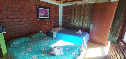 Кровать или кровати в номере Casa Hospedaje el Prado Eco turismo