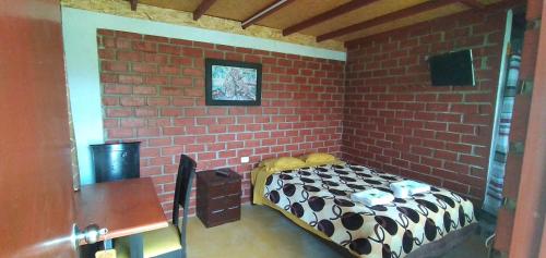 Letto o letti in una camera di Casa Hospedaje el Prado Eco turismo