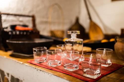 a group of glasses sitting on top of a table at Apartments Stinice in Gradac
