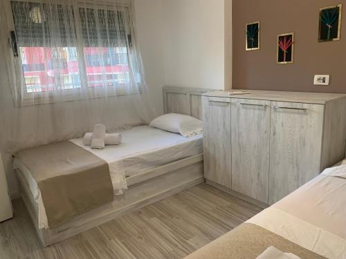 Llit o llits en una habitació de DaLucas Apartment