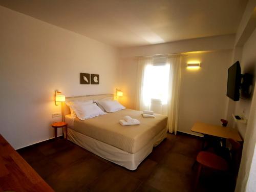 Ένα ή περισσότερα κρεβάτια σε δωμάτιο στο Κallisto rooms