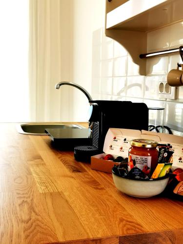 a kitchen counter with a toaster oven and a bowl of food at Κallisto rooms in Mytakas