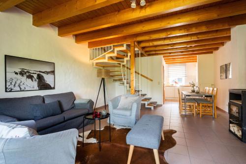 a living room with a couch and chairs and a table at Ferienhof Homann Sauerland in Brilon