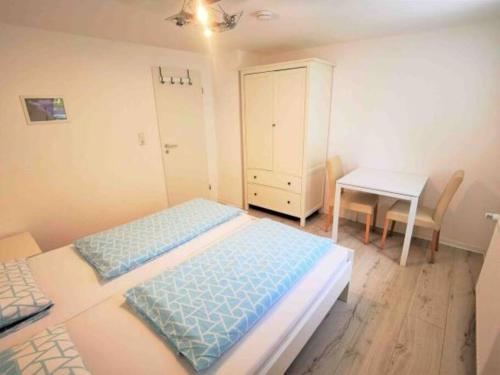 Cama o camas de una habitación en BlauerSeestern, Ferienwohnung in Allensbach