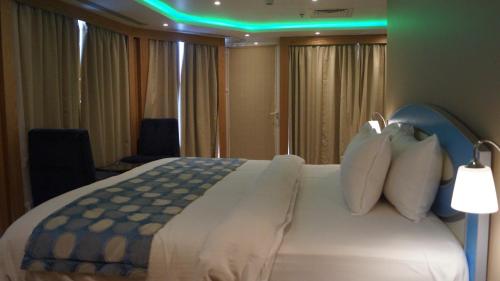 Un ou plusieurs lits dans un hébergement de l'établissement C Hotel