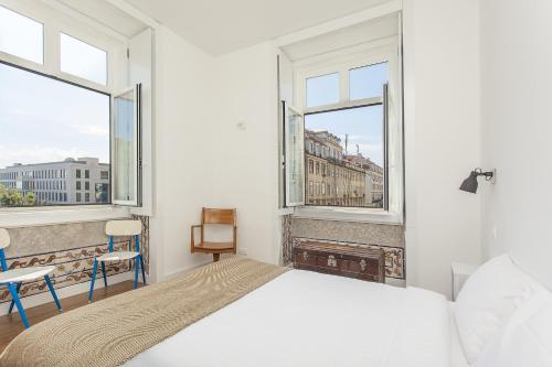 Postel nebo postele na pokoji v ubytování Lisbon Old Town Guest House