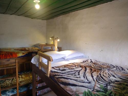 Cama o camas de una habitación en Hostal La Casa De Lili