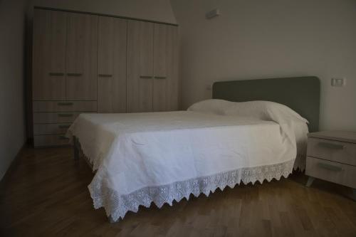 מיטה או מיטות בחדר ב-Vico Nove