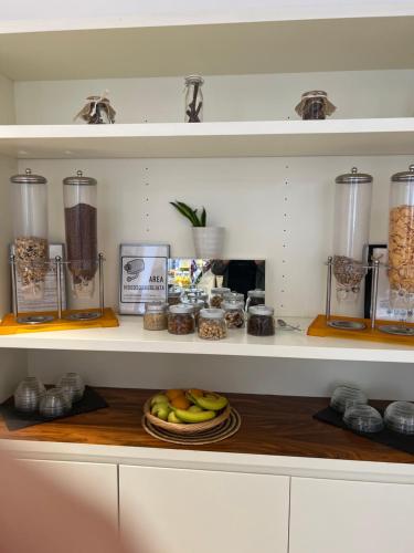 a shelf with food and other items on it at Card International Hotel in Rimini