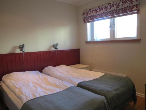a bedroom with two beds and a window at Åreguiderna - Bubblans lägenheter Åre Torg in Åre