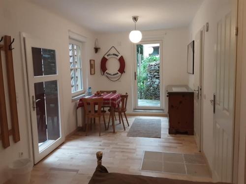 a hallway with a table and a dining room at Haus zum Prater in Spitz