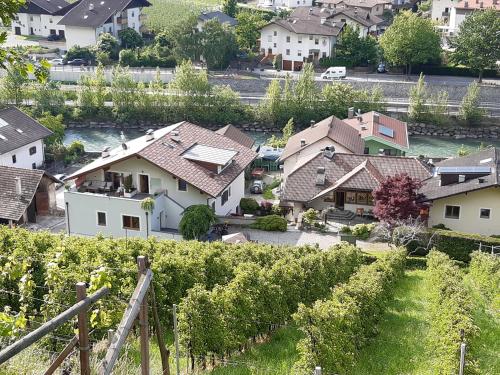 arial view of a village with houses and vines at Brunnerhof in Naturno