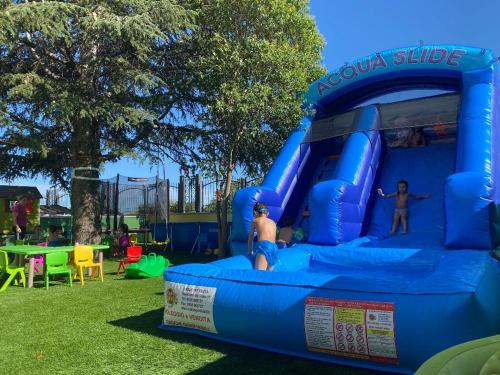 a bounce house at a playground with two people on it at Gran Paradiso Hotel Spa in San Giovanni Rotondo