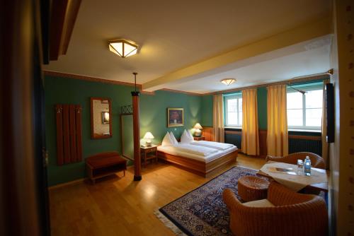 A bed or beds in a room at Gasthof Hotel Zweimüller