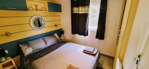 a small bedroom with a bed in a room at Los Gallardos Leisure in Los Gallardos