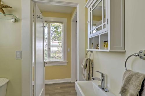 a bathroom with a sink and a window at Carpinteria Apt with Hot Tub - 10 Min Walk to Beach! in Carpinteria
