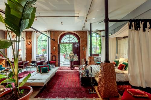 a bedroom with a bed and a living room at Lisbon Unique Apartments in Lisbon