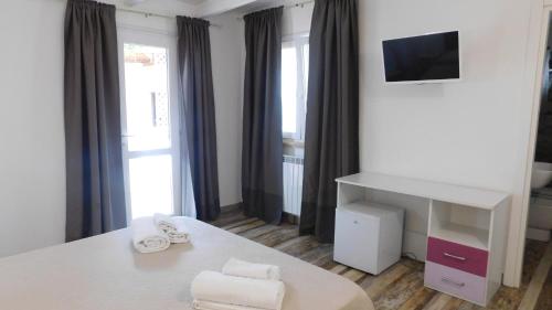 Cama o camas de una habitación en Villa Raggio di Sole parcheggio privato