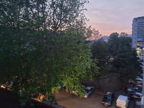 a group of cars parked in a parking lot at Apartman VeM in Bar