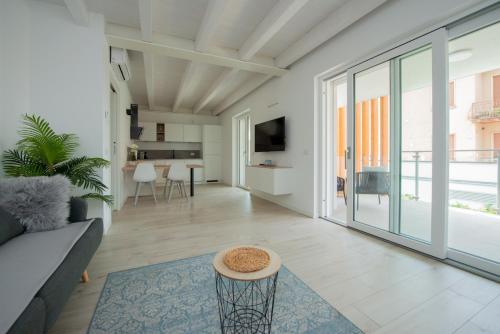 a living room with a couch and a table at Lake Dream Apartment with Pool in Bardolino in Bardolino