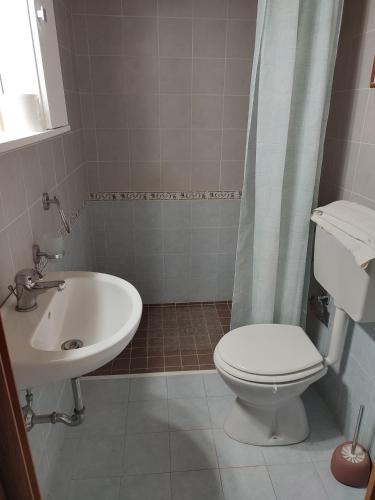 a bathroom with a toilet and a sink at Le Due Palme in Marsala