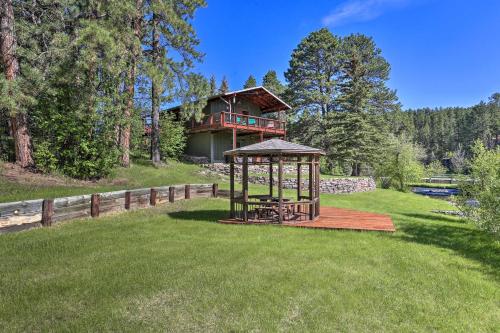 a gazebo in the yard of a house at Creekside Rapid City Cabin with Deck on 30 Acres! in Rapid City