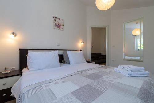 Ένα ή περισσότερα κρεβάτια σε δωμάτιο στο Apartments Barba