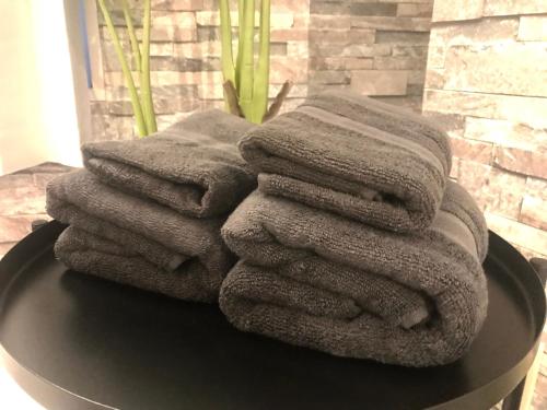 a pile of towels sitting on top of a table at Chatley Yoyogi 2 - Vacation STAY 12246 in Tokyo