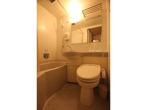 a bathroom with a toilet and a sink and a tub at AZ Inn Obu - Vacation STAY 71878v in Obu