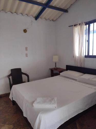 Postel nebo postele na pokoji v ubytování Finca exclusividad familiar o grupo de amigos capacidad hasta 12 personas calles en placa huella, caminata ecológica