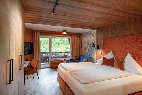 Postel nebo postele na pokoji v ubytování Hotel Sonnenhof