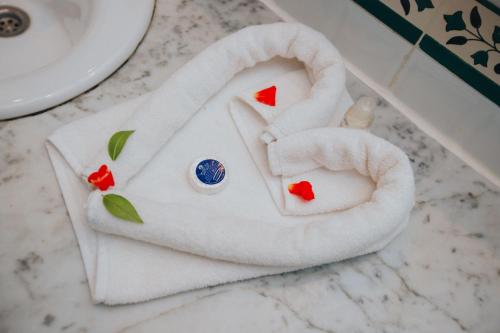 a white towel with an elephant head on a bathroom counter at Hotel Soussana in Sousse
