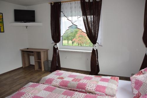 Cama o camas de una habitación en Harmonie Stüberl